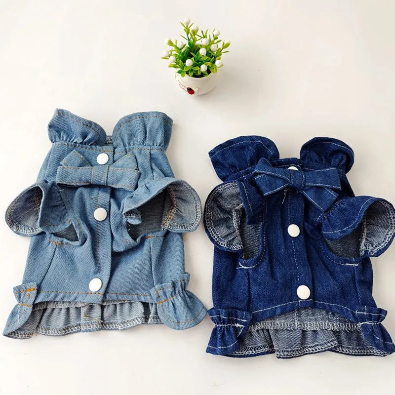 Blue denim dog dress vest with ruffles and a metal leash hook on the back for small dogs.