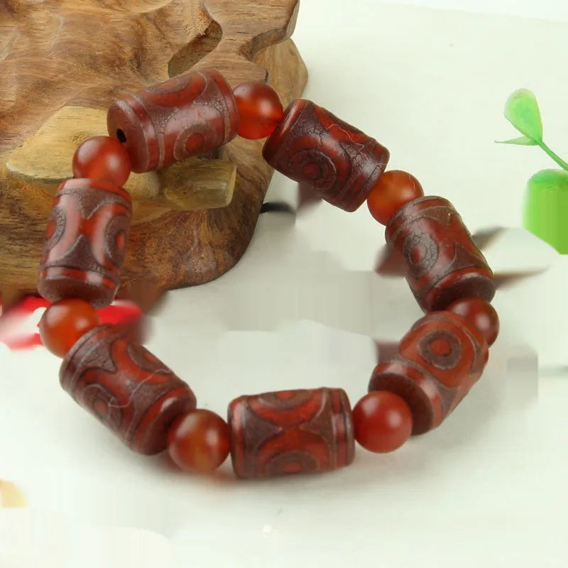 Agate Tibetan dzi bead bracelet with three-eye design and polished finish