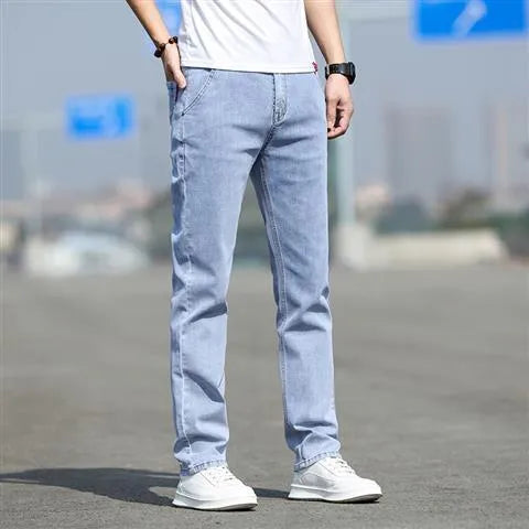 Men's straight leg jeans in smoky grey colour with a low waist and zipper fly