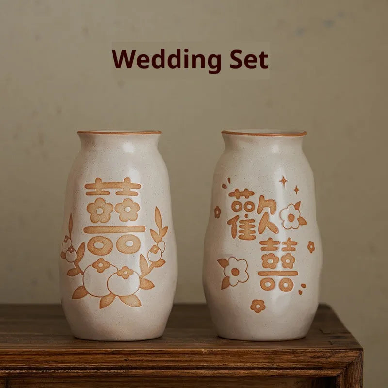 Chinese hand-painted ceramic vase with persimmon fruit designs on wooden desktop