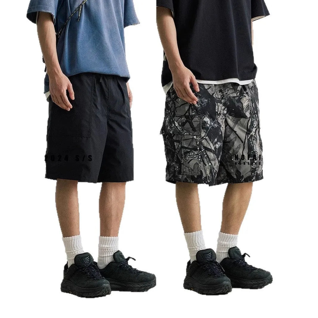 Loose casual straight-leg denim shorts in army green with a zip fly and elasticated waistband.