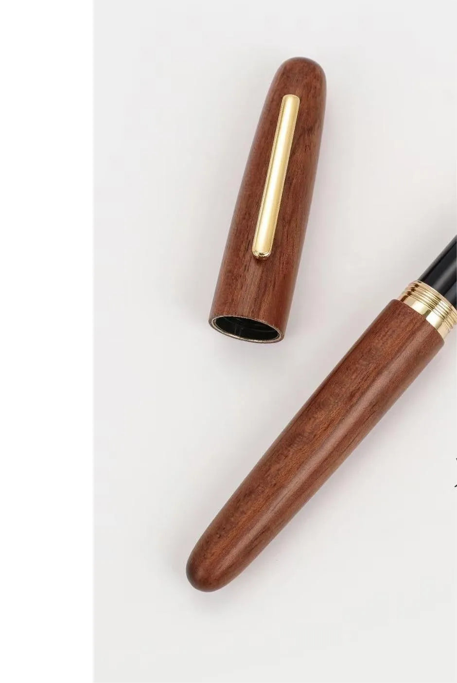 Wooden fountain pen with rotating cap showing natural wood grain