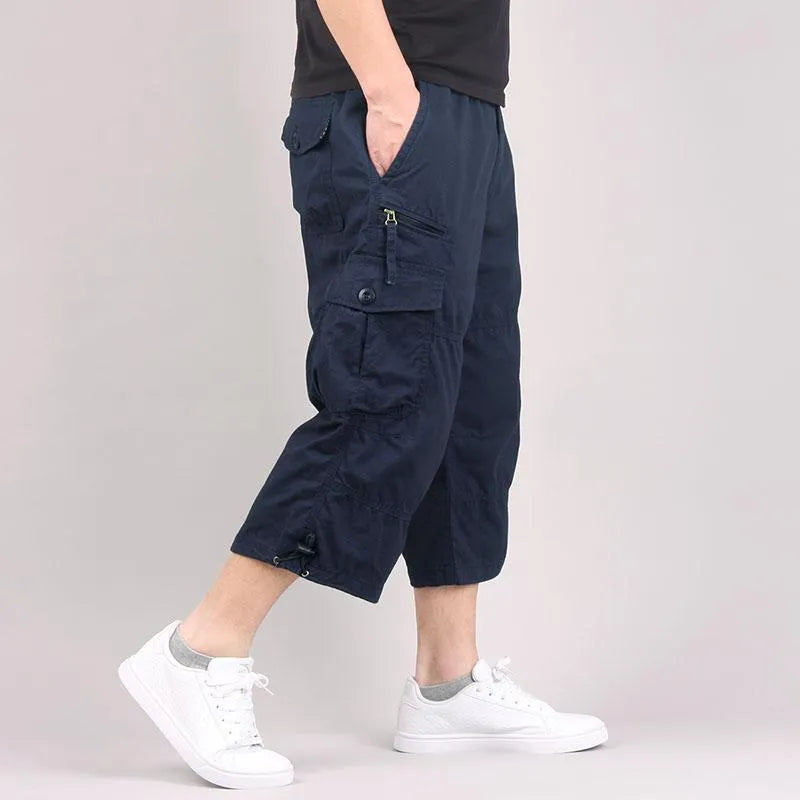 Men's loose-fit cotton cropped casual pants in army green colour on a white background