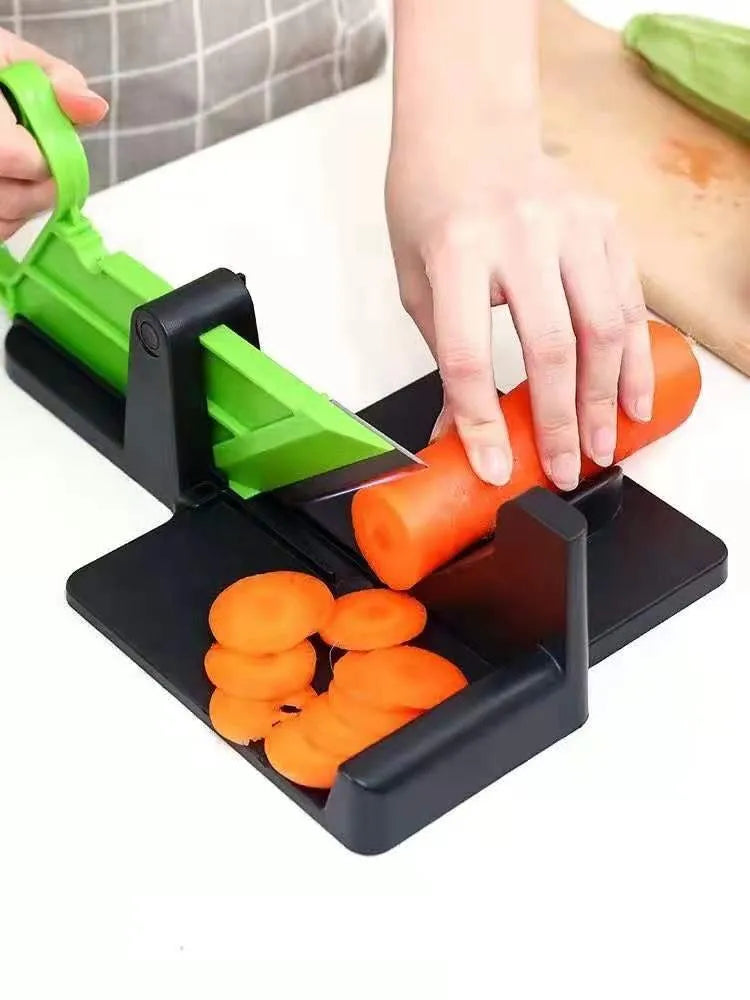 Green plastic vegetable cutter with stainless steel blades for cutting carrots and potatoes