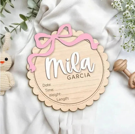 Square wooden ornament laser-engraved with a custom name for baby room decoration.