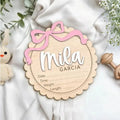 Square wooden ornament laser-engraved with a custom name for baby room decoration.