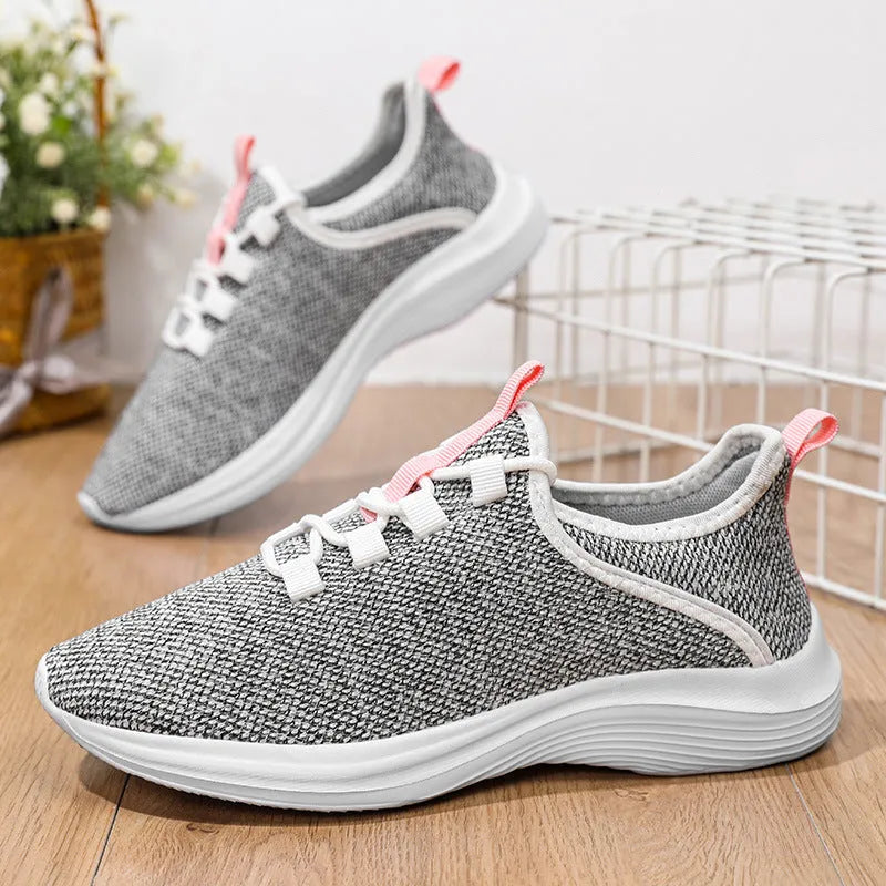Women's low-top black mesh casual sneakers with lace-up front and round toe on a white background.