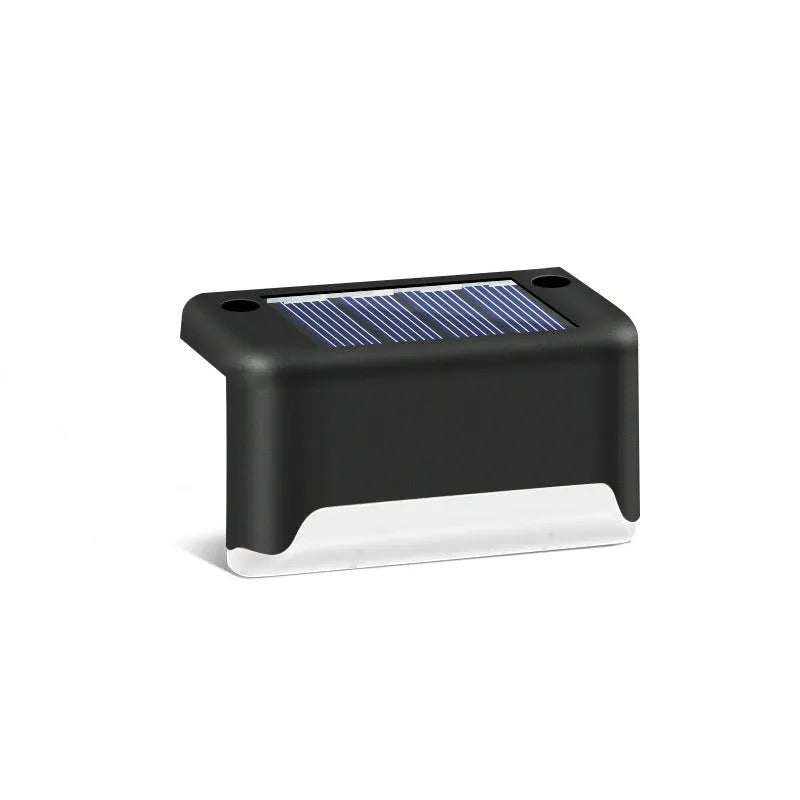 Solar garden stair light in black with warm light, compact ABS housing for outdoor courtyard use