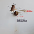 Retro wood and iron wall lamp with long adjustable arm and visible wall switch