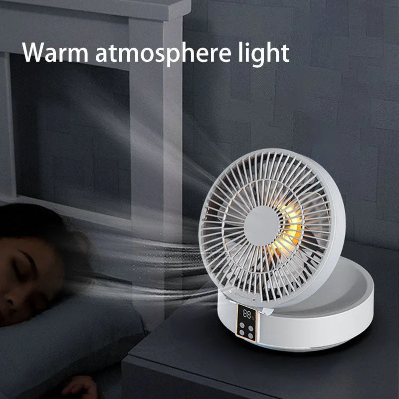White portable USB rechargeable folding ceiling fan with remote control on desk