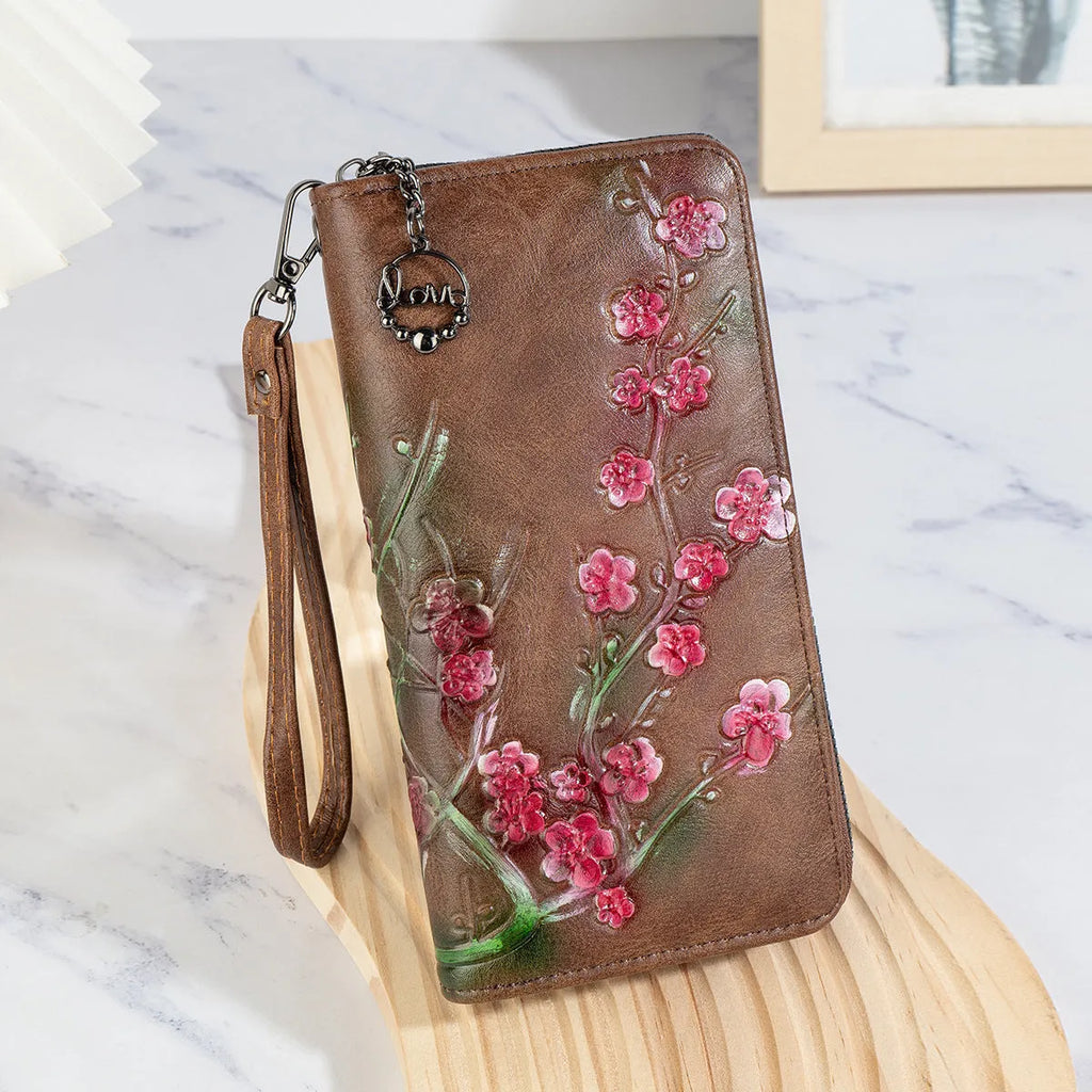 Embossed Chinese style handbag with floral pattern and zipper closure in black colour