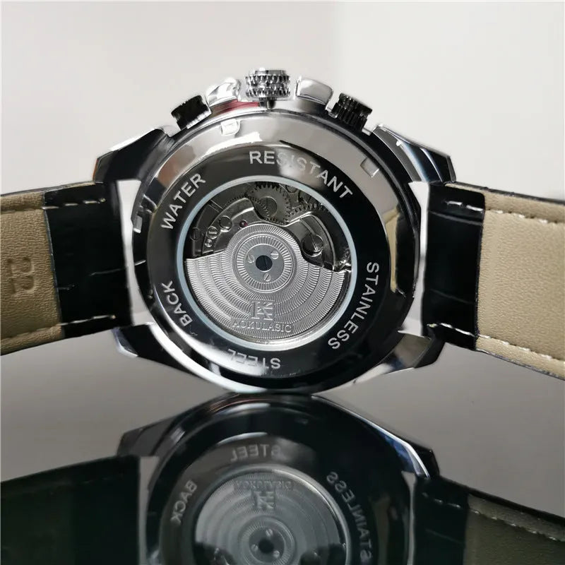 Men's automatic mechanical watch with silver case and black dial showing 12mm thickness