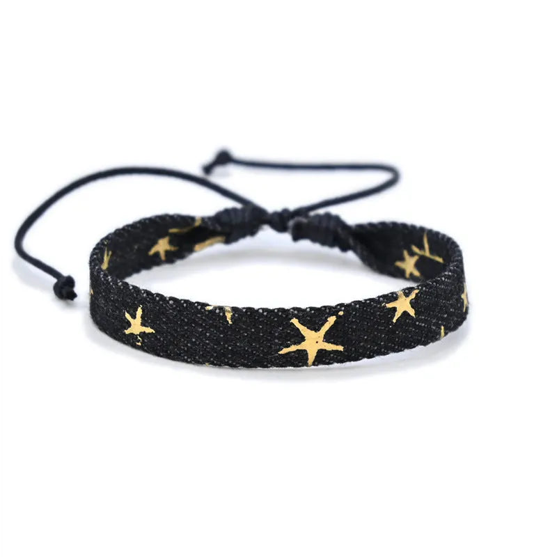 Handmade denim fabric wristband carrying strap in mixed materials with adjustable closure
