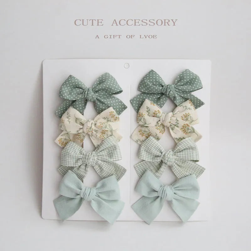 Children's eight-piece cloth bow hairclip set in dovetail shape with multiple colour options