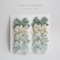 Children's eight-piece cloth bow hairclip set in dovetail shape with multiple colour options