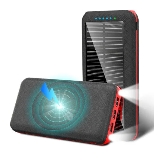 Black portable power bank with wireless charging pad on top, three USB ports, and an LED flashlight.