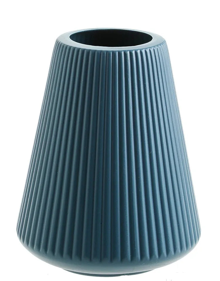 Melamine plastic decorative vase 16cm diameter in blue colour on wooden desktop