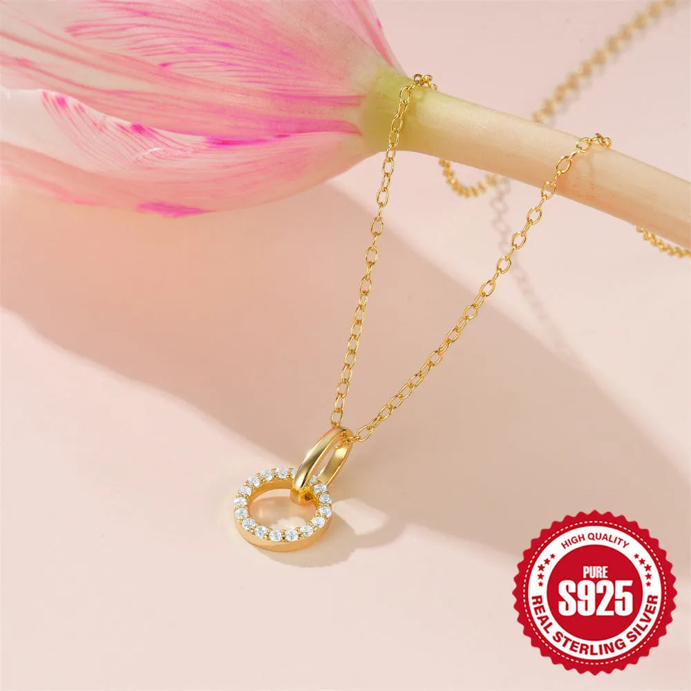 Gold-coloured geometric pendant on adjustable sterling silver clavicle chain necklace
