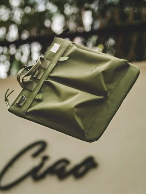 Medium vertical square canvas crossbody messenger bag in military green with shoulder strap