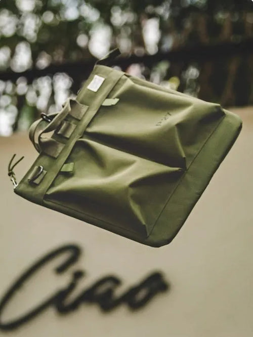 Medium vertical square canvas crossbody messenger bag in military green with shoulder strap