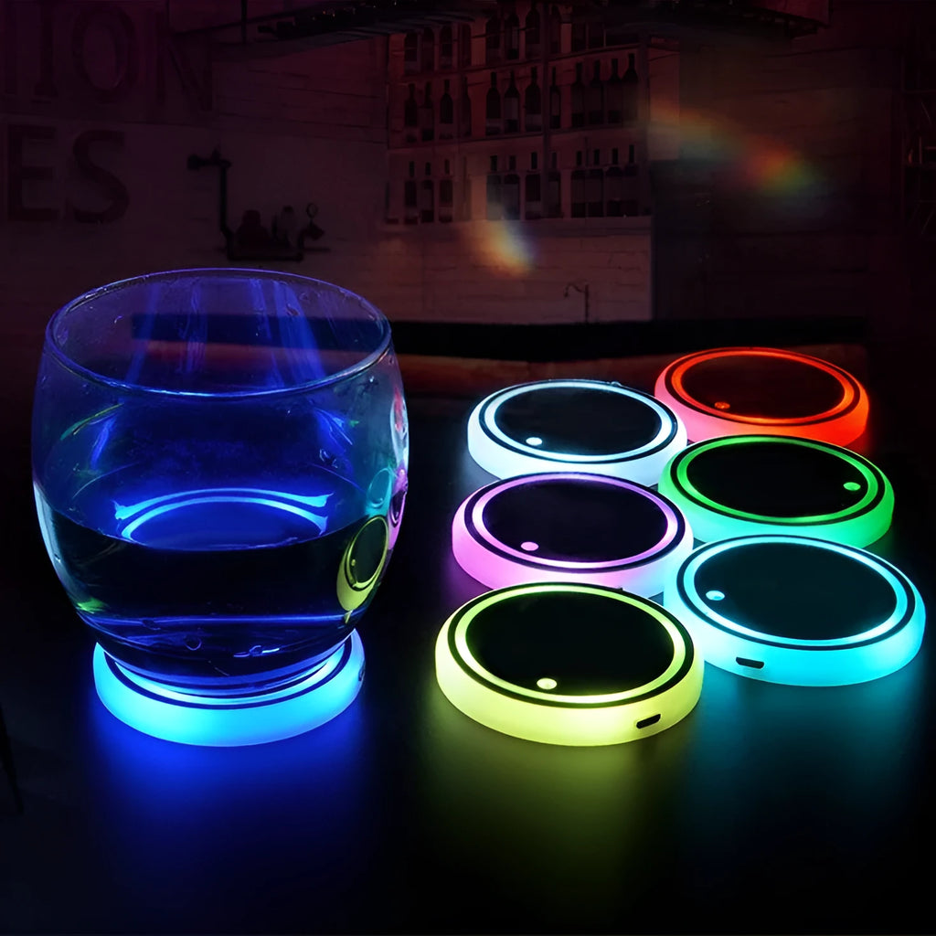 Colourful LED light-up coaster for car cup holder showing seven light colours and USB cable.