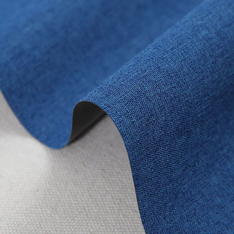 A piece of black, blue, or green polyester ant cloth fabric for luggage and furniture.