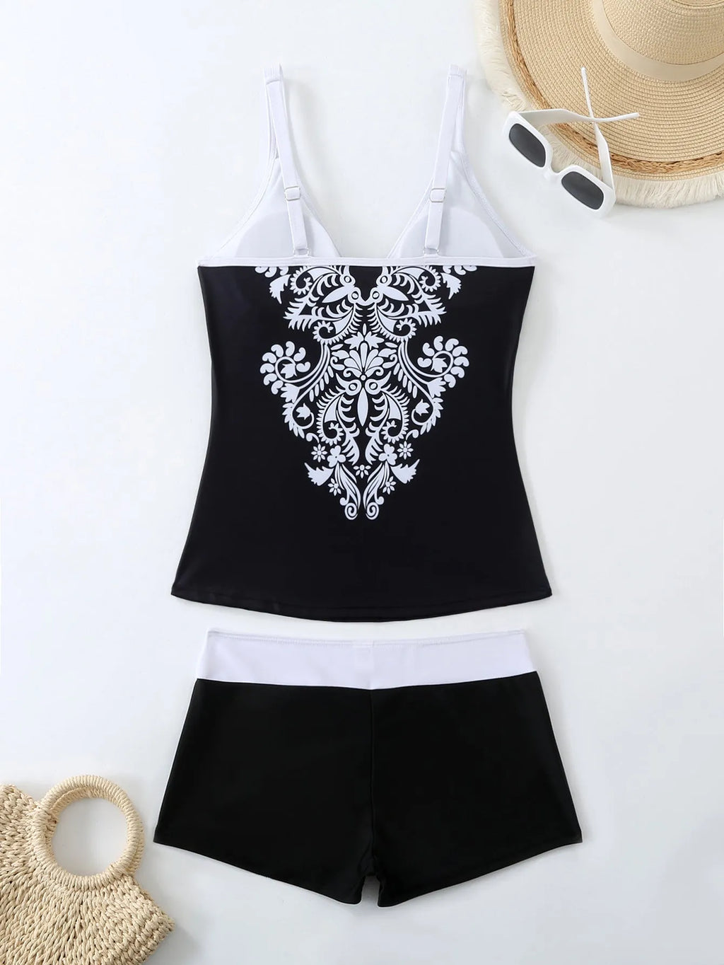 Plus size black printed swimsuit briefs for women on a hanger.