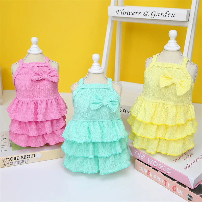 Small dog wearing princess dress with layered skirt in polyester fabric