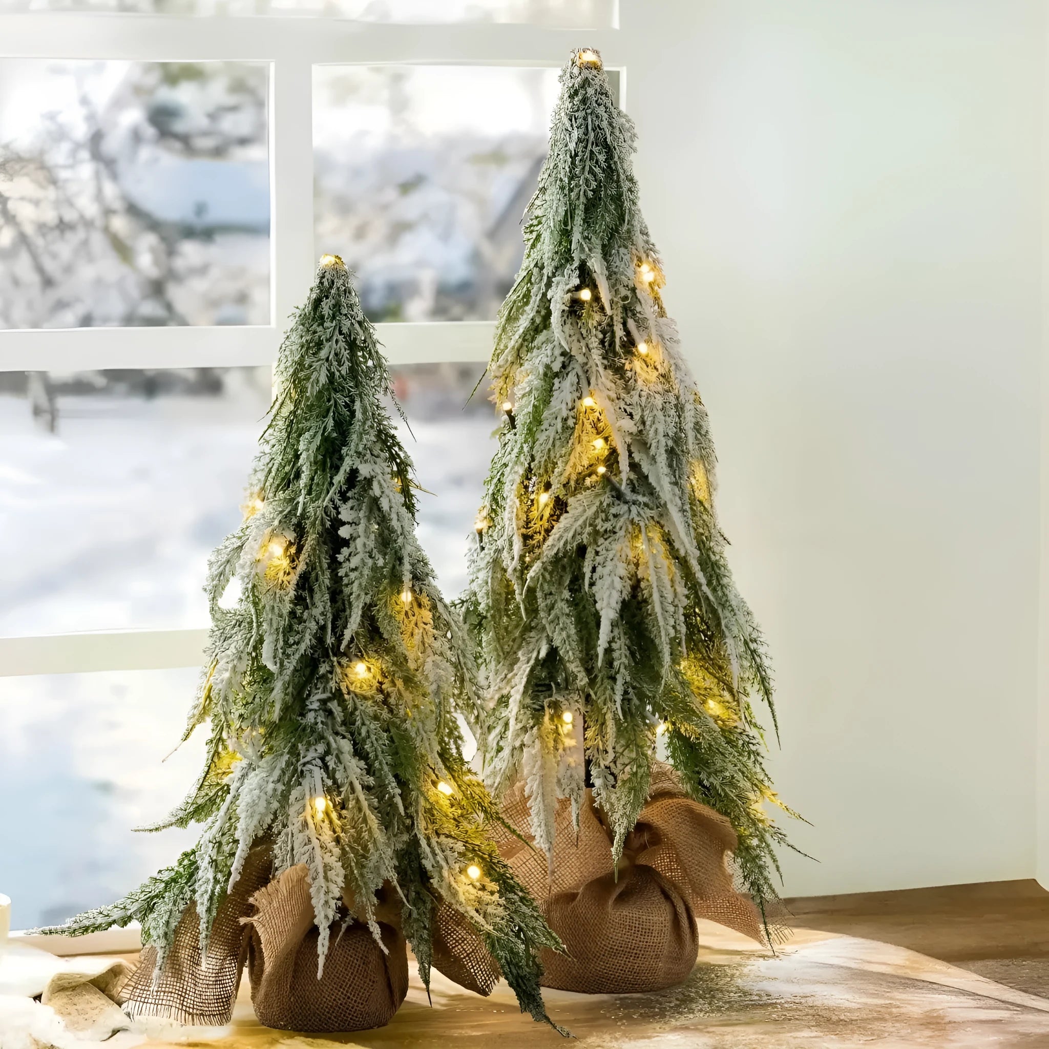 24-inch plastic Christmas tree with PE simulation snow spray effect and built-in lights on desktop