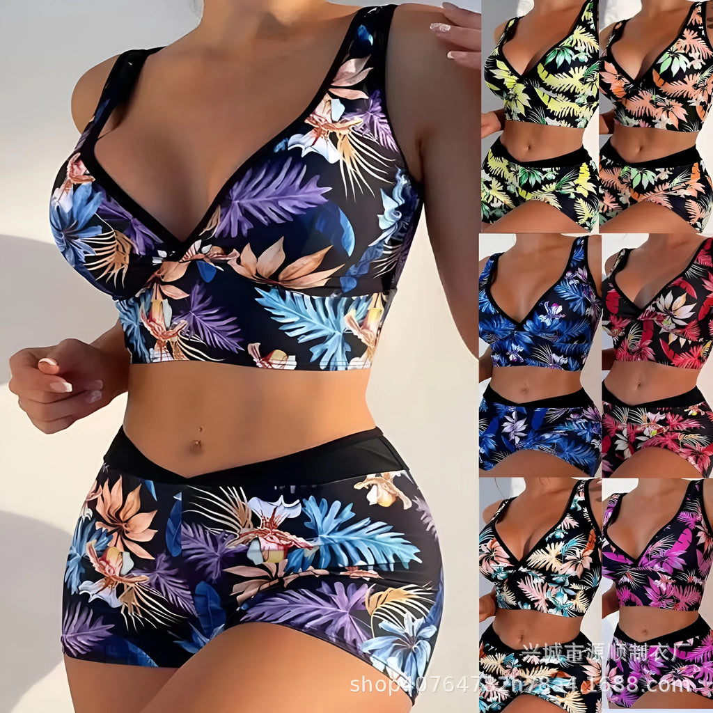 Women's two-piece printed swimsuit with high-neck top and boxer shorts in a multi-colour design.