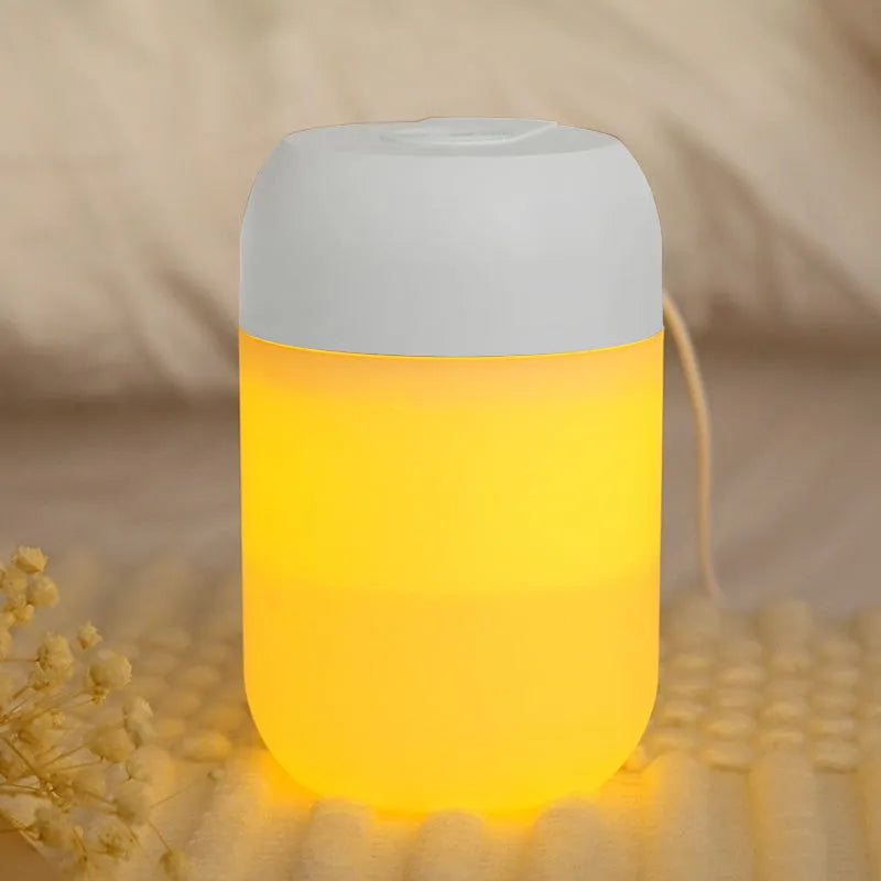 White cylindrical mini humidifier with USB cable for small room aromatherapy and humidification