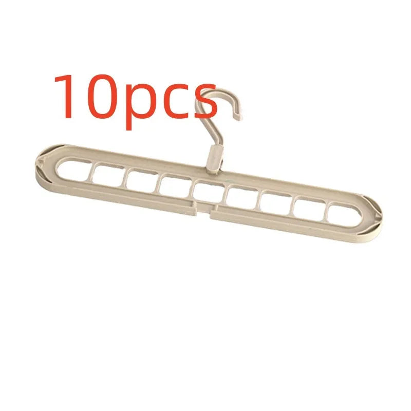 Green plastic nine-hole folding pant hanger for trousers and skirts.