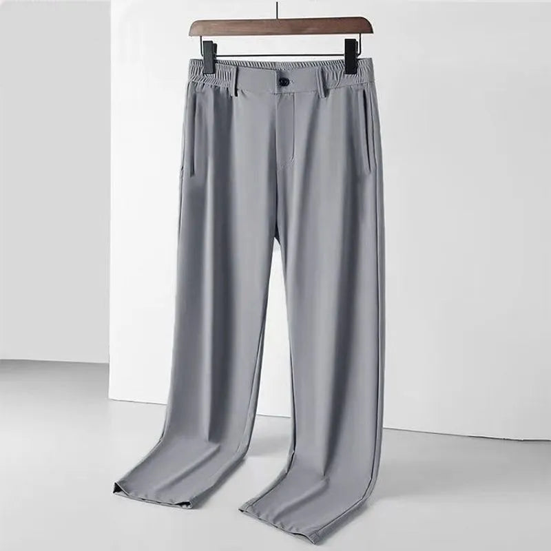 Men's solid colour ice silk straight-leg trousers with an elasticated open waistband, shown in black.
