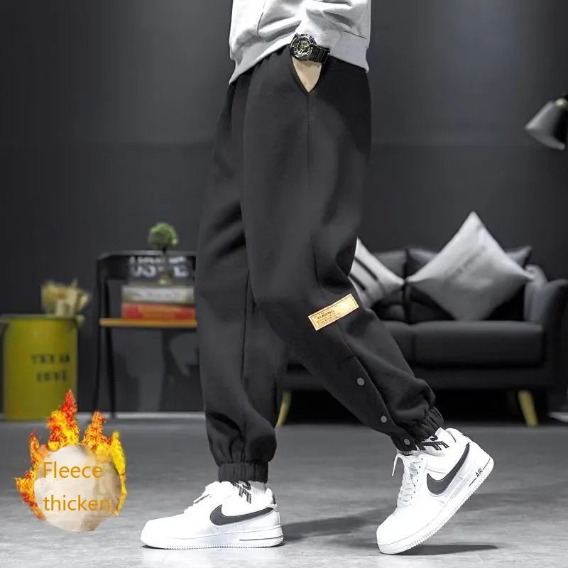 Velvet padded casual trousers for women in regular black with ankle strap and skinny leg style