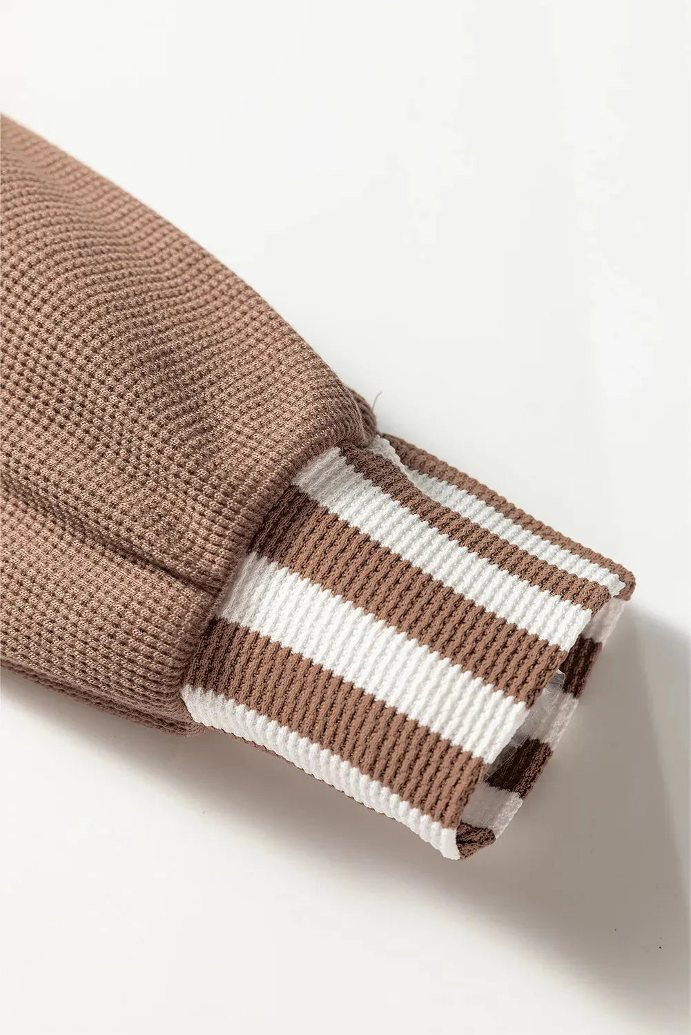 Straw yellow hoodie with waffle texture fabric, striped patchwork panels, button neck, and drawstring waist.