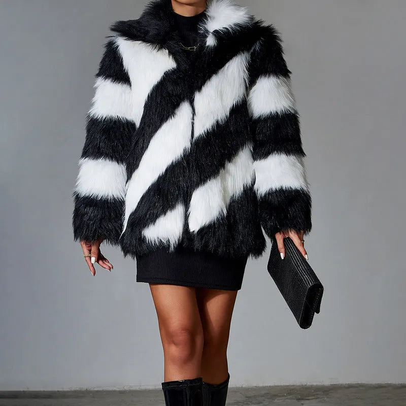 Faux fur coat with contrasting colour lapel and a attached fur collar.