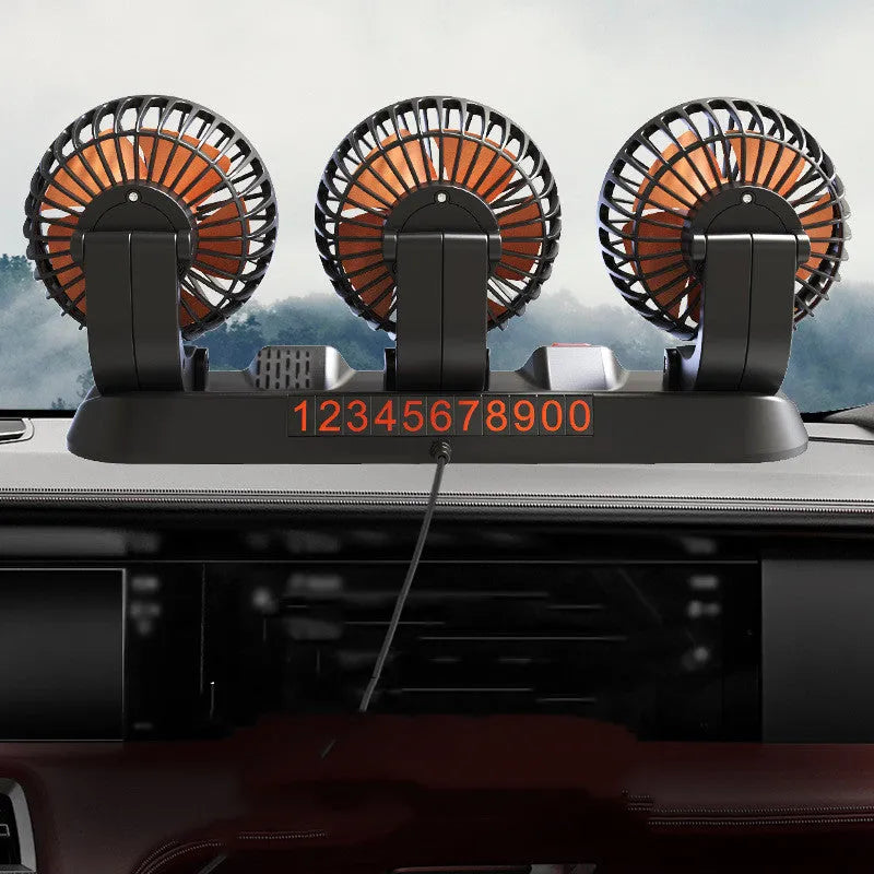 Three head automotive cooling fan with long cable for car dashboard or cabin use.