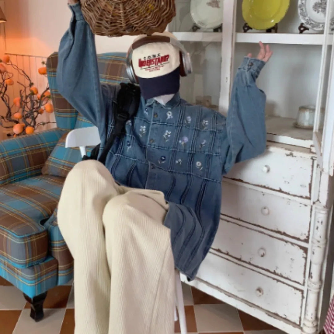 Vintage small floral pleated washed denim long sleeved blue shirt on hanger