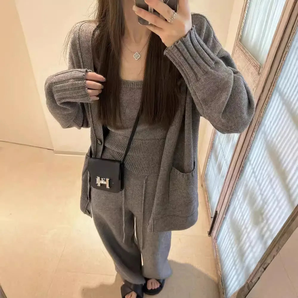 Women's loose fit wool blend cardigan three-piece set in beige, showing vest, coat, and casual pants.