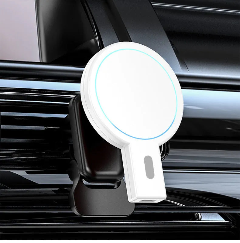 White magnetic wireless phone charger with USB cable on wooden desk