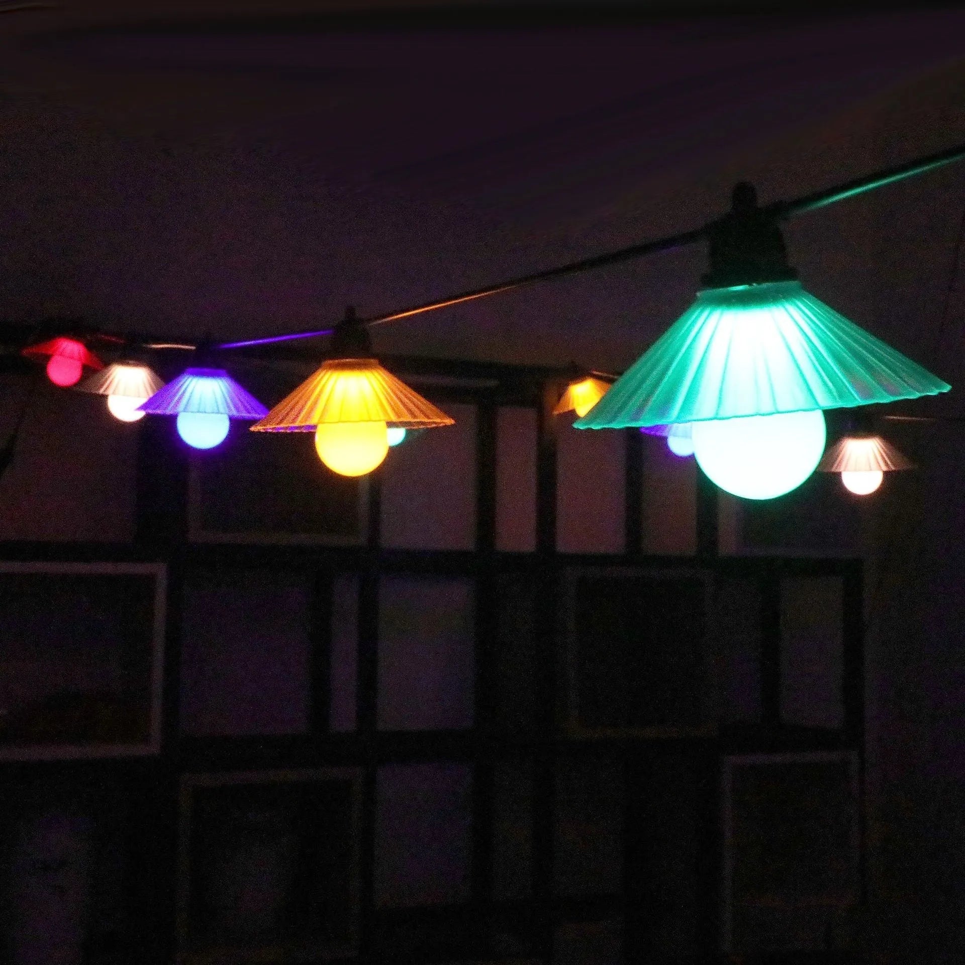 Outdoor flower-shaped LED string lights with IP65 rating for garden and patio use.