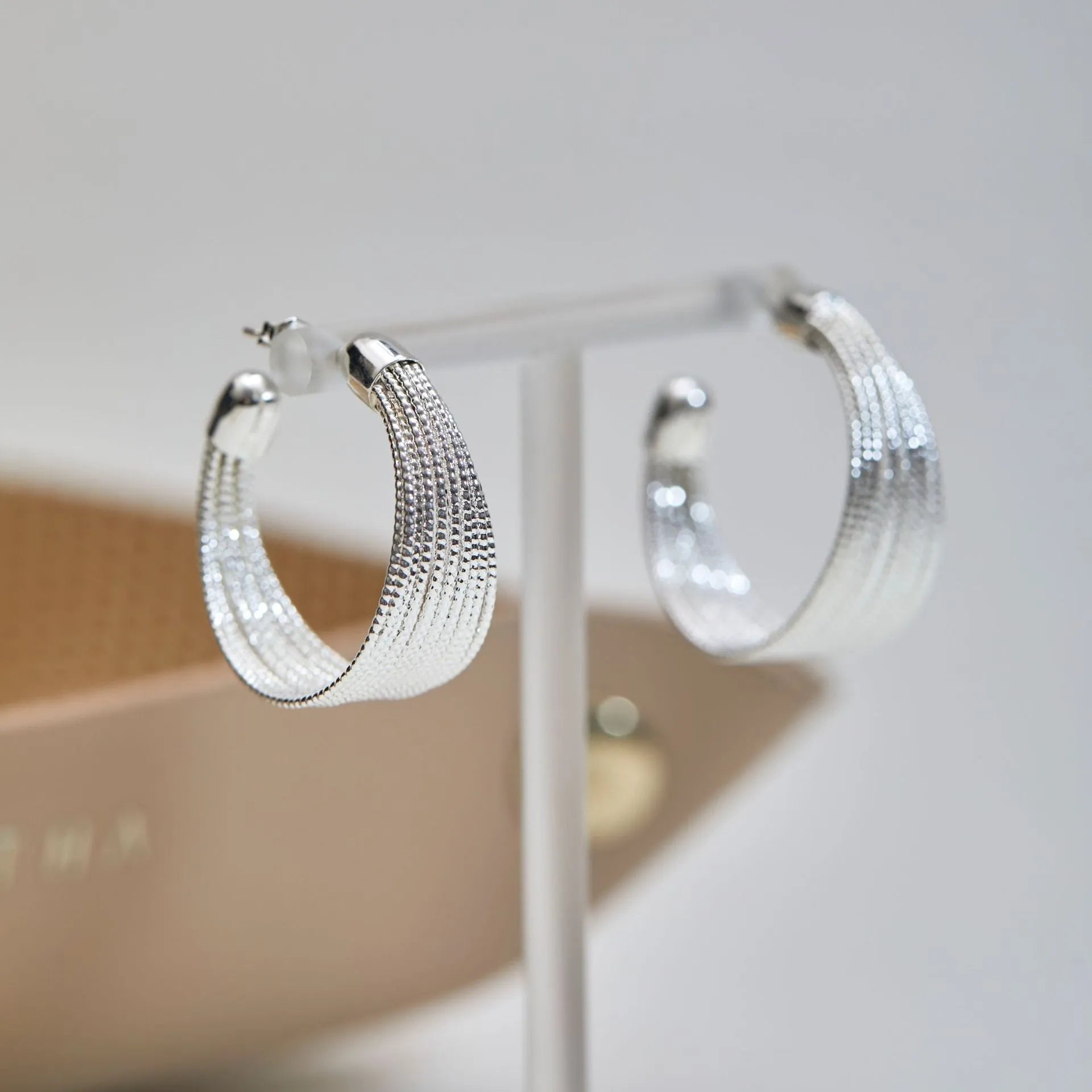 Multi-layer geometric bracelet earrings in gold and silver colour options as studs and clips