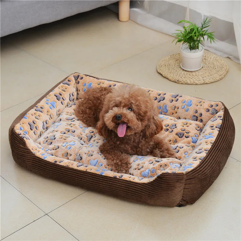 Beige plush sofa-style pet bed for a small dog, showing bolstered sides and padded construction.