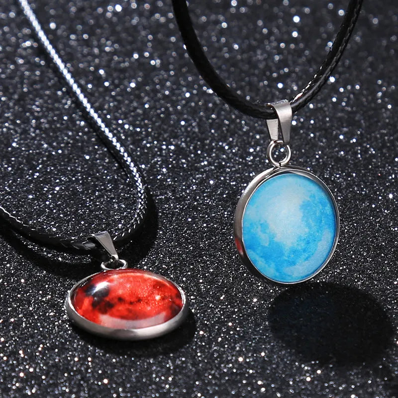 Luminous moon and constellation design pendant on an alloy necklace chain with extension.