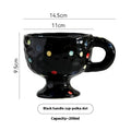 Hand-pinched irregular ceramic mug with solid colour design, approximately 14.5cm tall