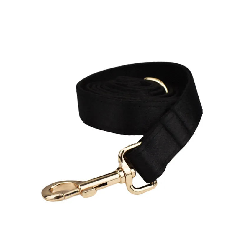 Cloth dog collar and leash set with matching decorative bow and dog vest on a size chart showing S, M, L, XL.