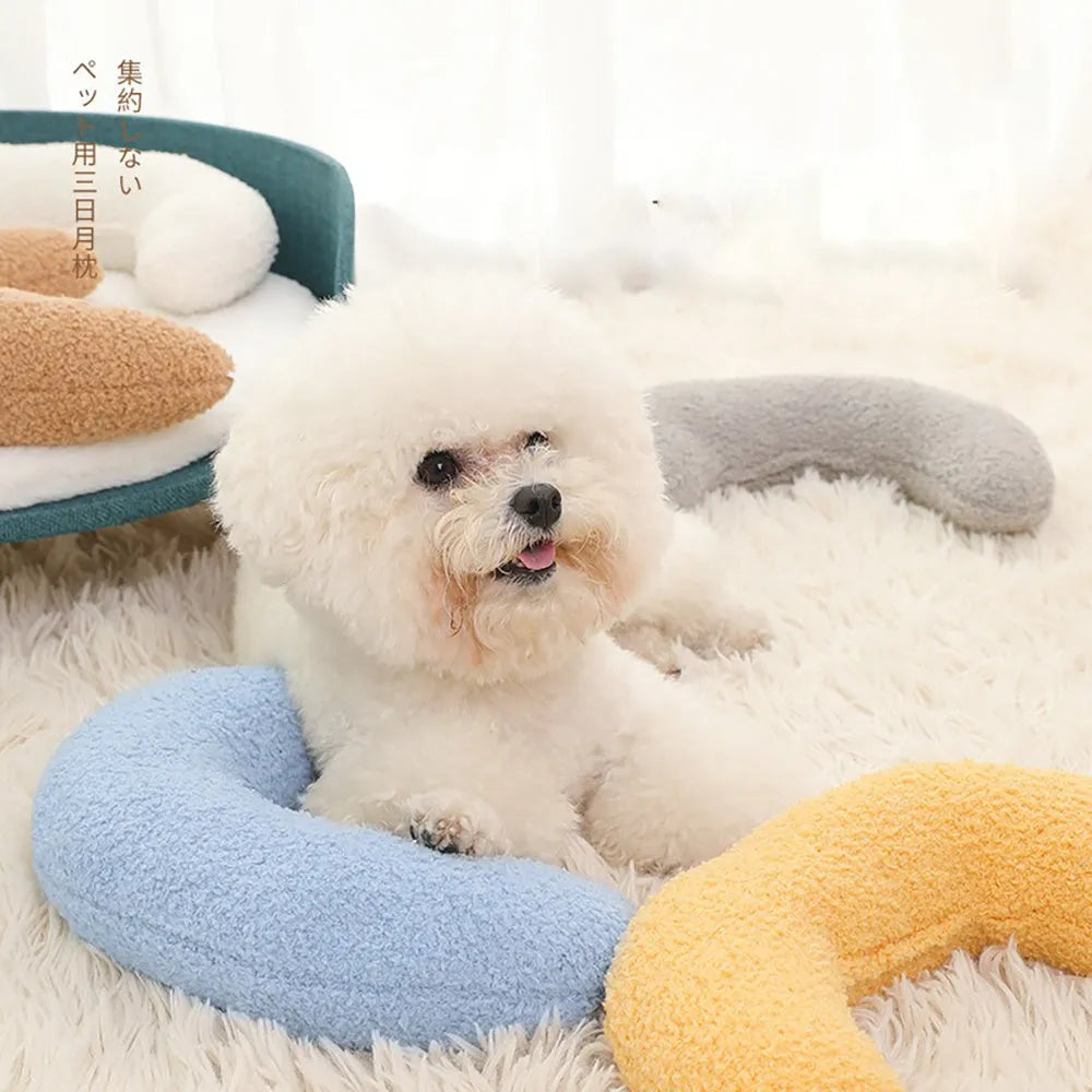 U-shaped blue cat pillow with adjustable collar for cervical support on a sofa