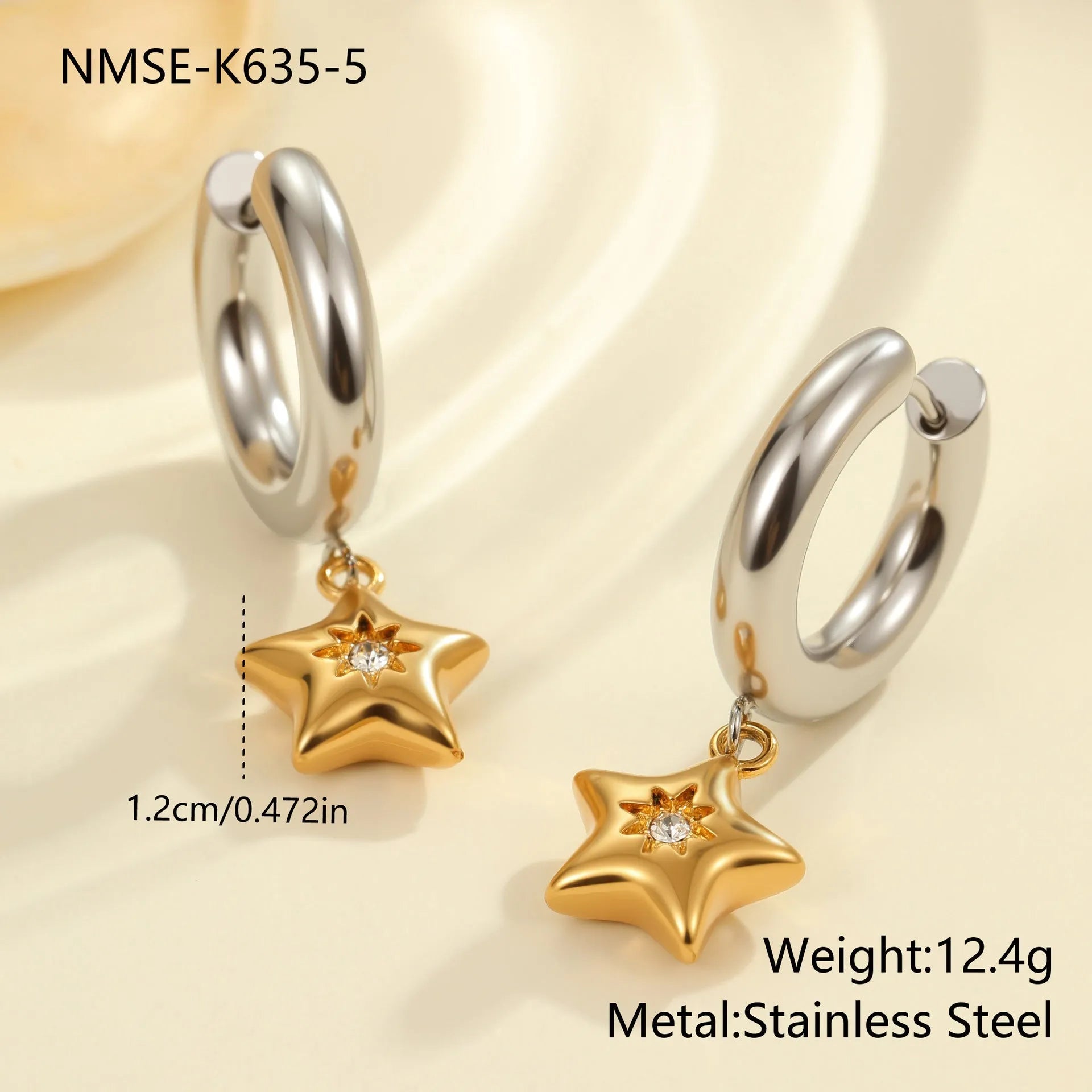 A pair of stainless steel earrings with an 18K gold colour finish, shown in a Christmas tree shape and a heart shape.