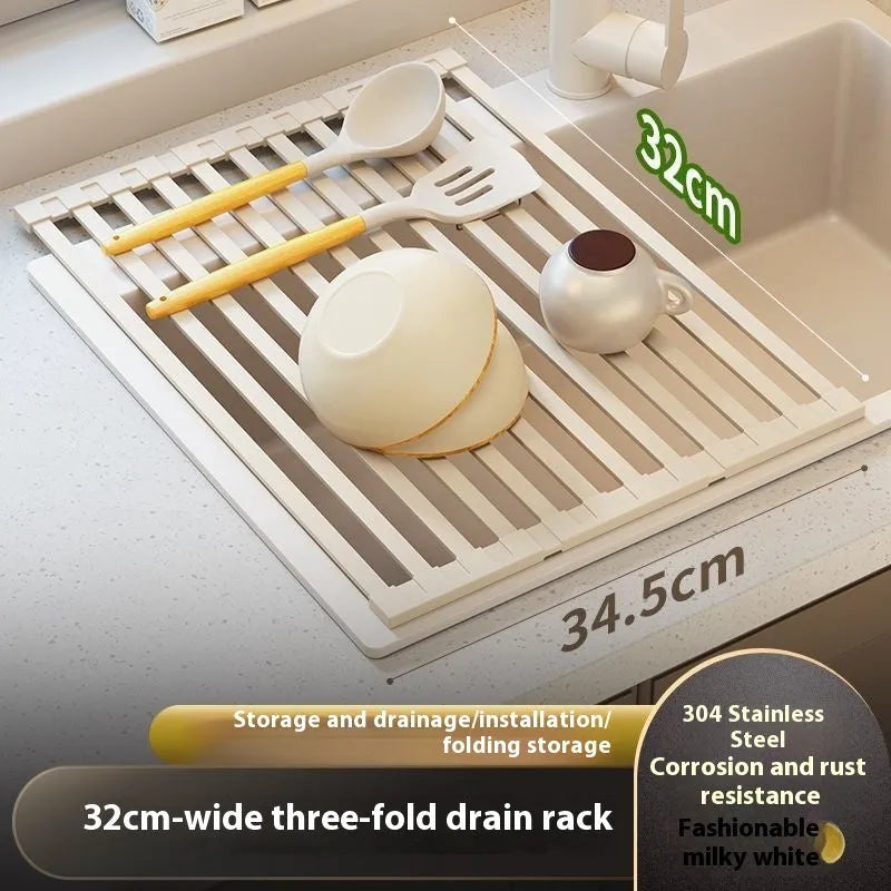 Milky white foldable stainless steel kitchen draining rack shown next to a sink.