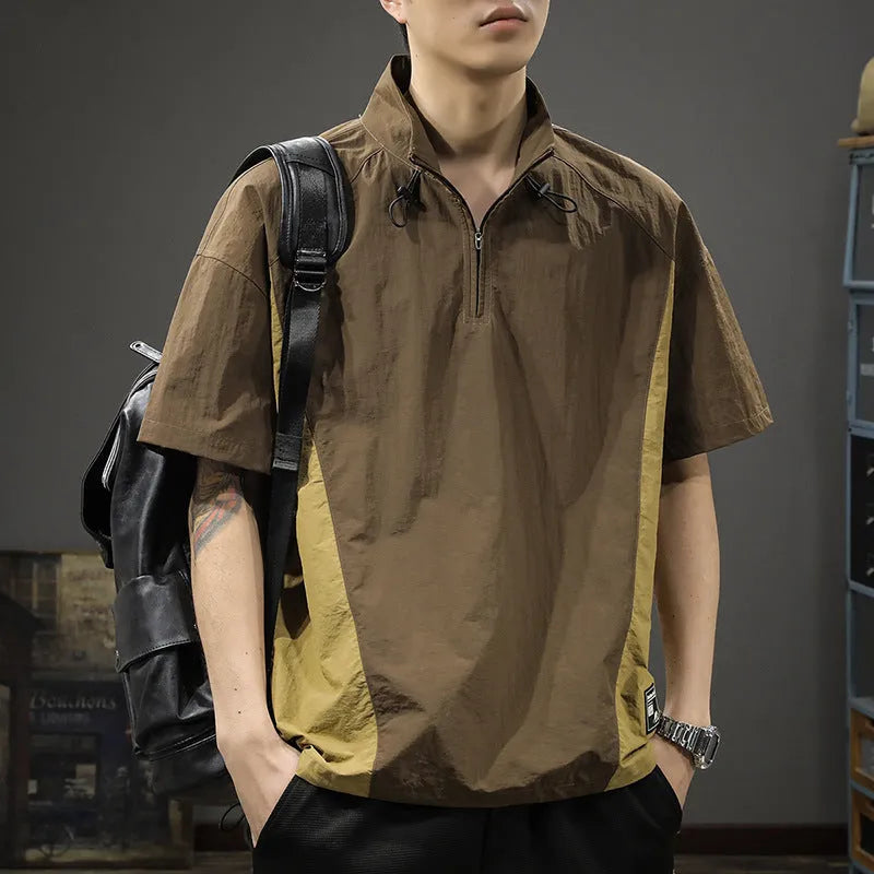 Brown men's half-zip stand collar short sleeve casual shirt laid flat, showing fleece lining and loose fit.